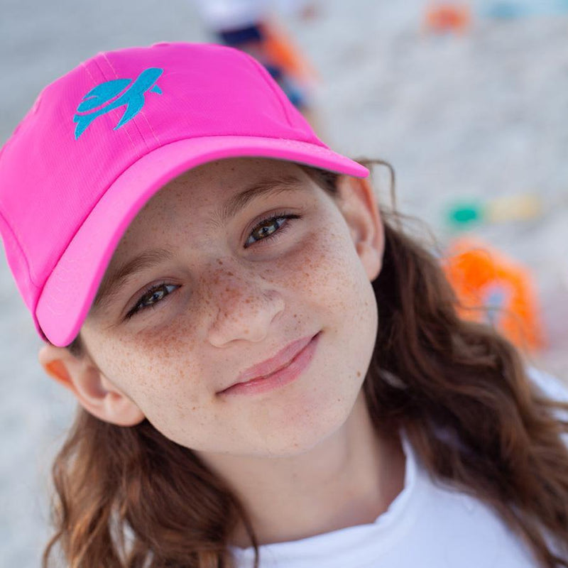 Girl wearing Turtle Classic Kids on beach
